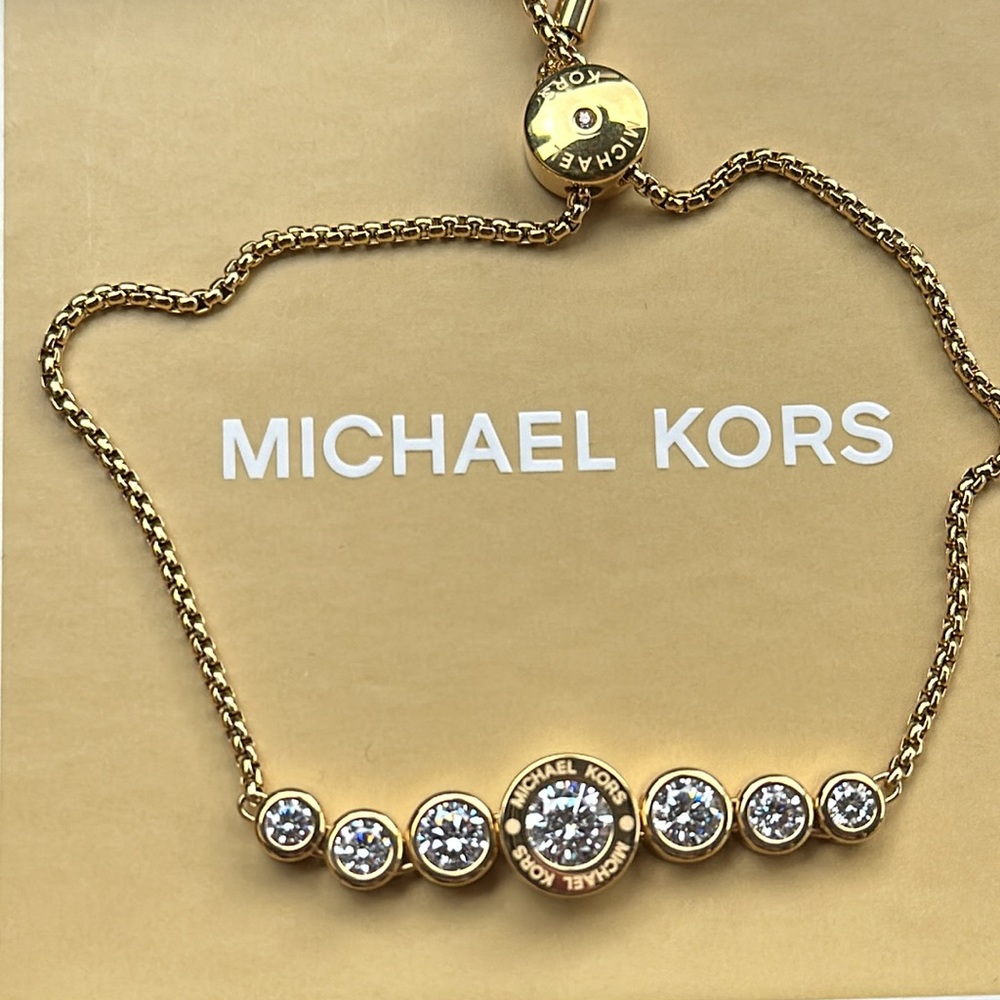 Michael Kors gold slider bracelet.